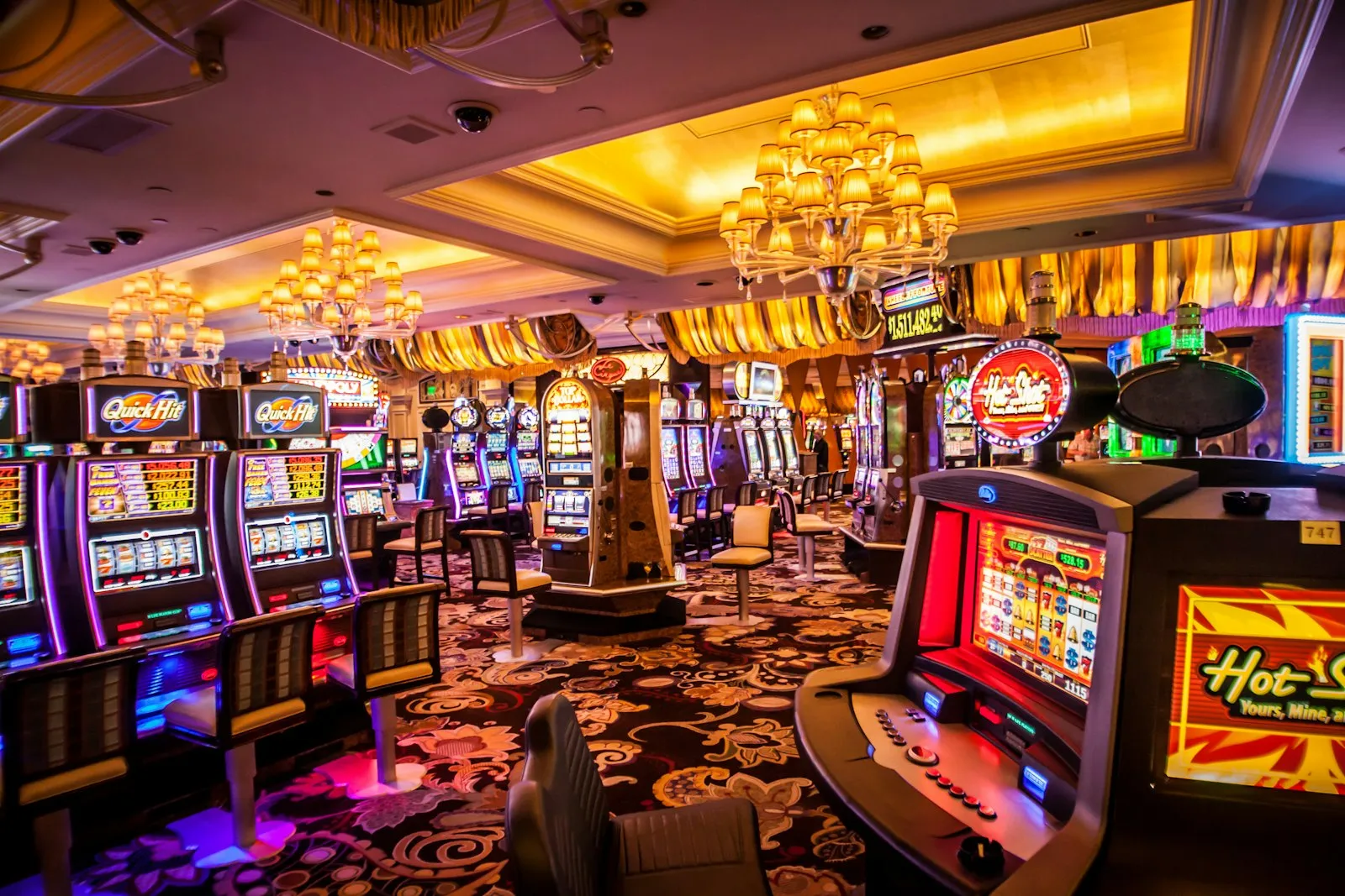 Casino floor with illuminated slot machines